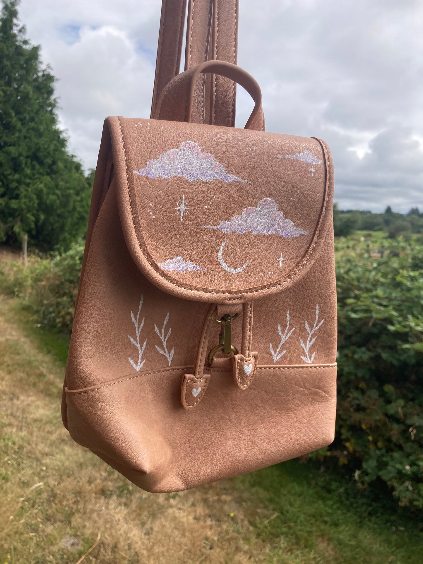 Clouds, crescent moon and ferns backpack bag