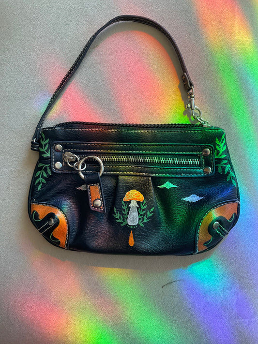 Black wristlet handpainted with orange white and green