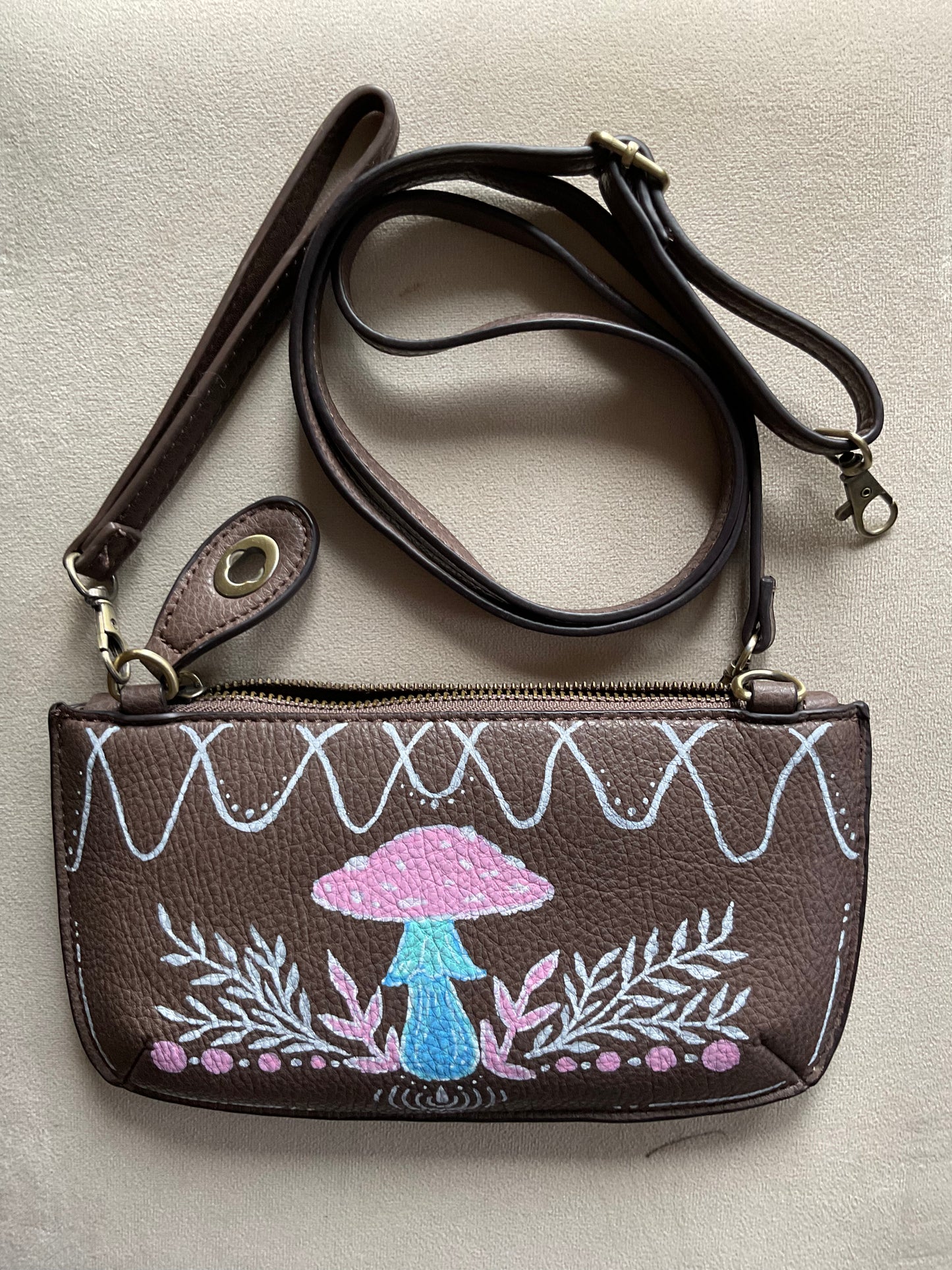 Brown crossbody/wristlet handpainted with pinks and blues