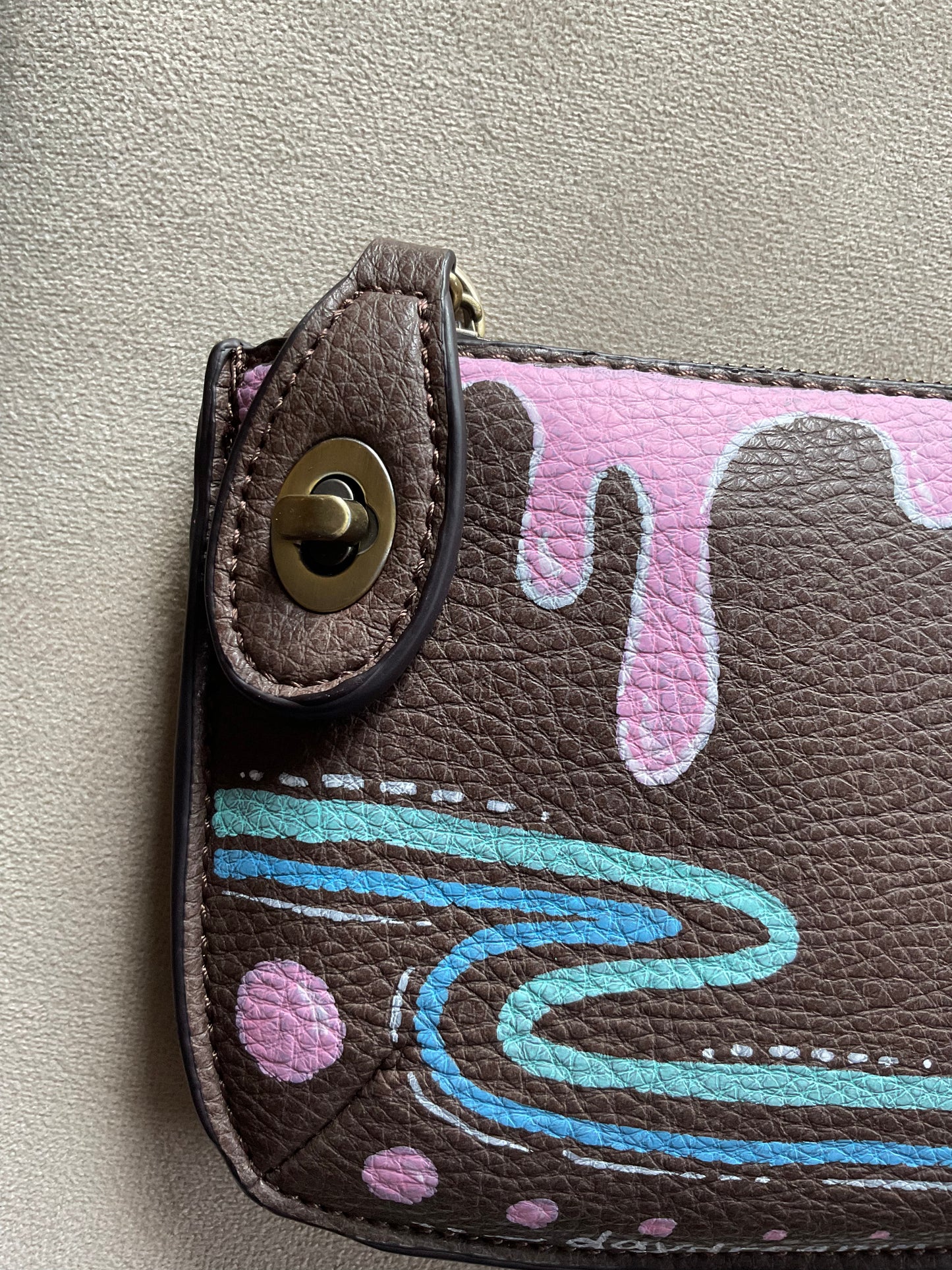 Brown crossbody/wristlet handpainted with pinks and blues