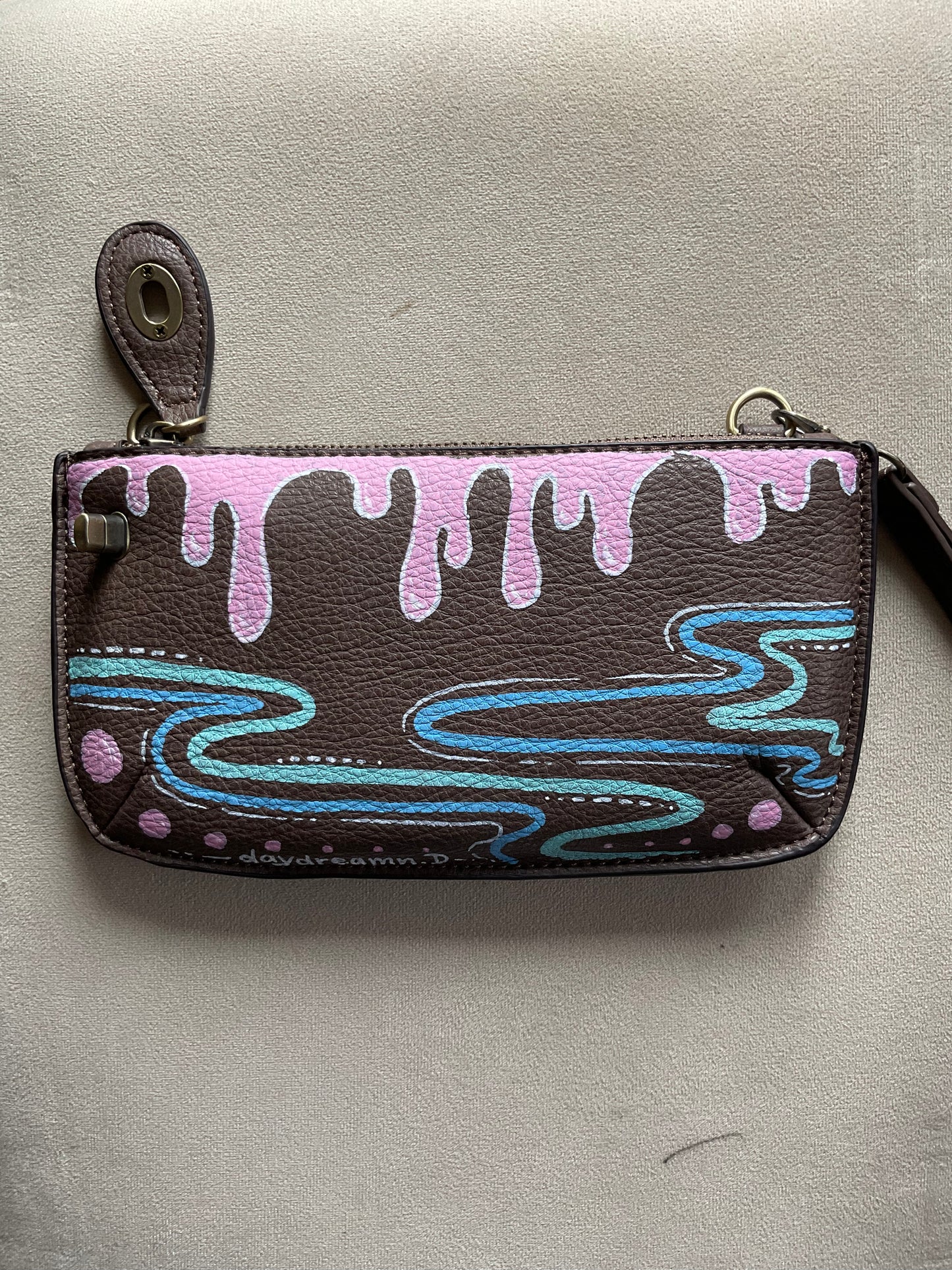 Brown crossbody/wristlet handpainted with pinks and blues